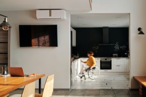 woman in wheelchair in her kitchen