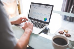 man looking into the key metrics of SEO website