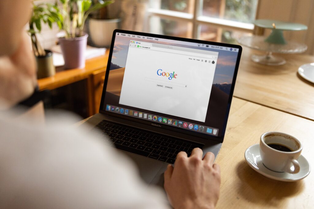 man using google on laptop