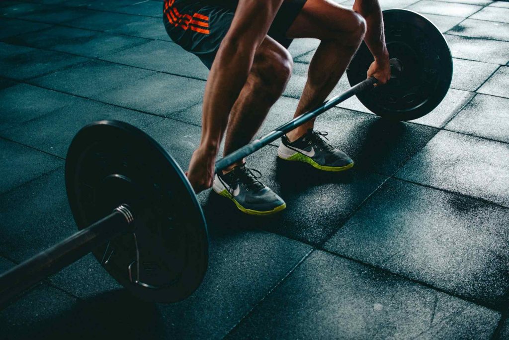 man lifting weight in the gym